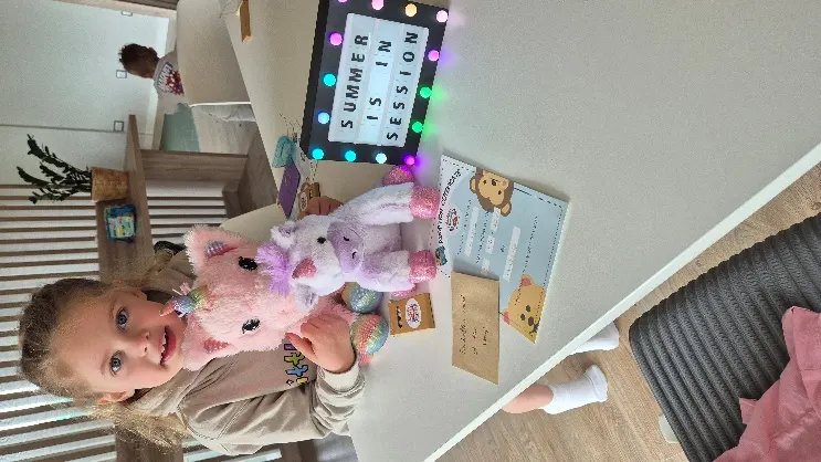Child celebrating with her Little Lotus workshop craft